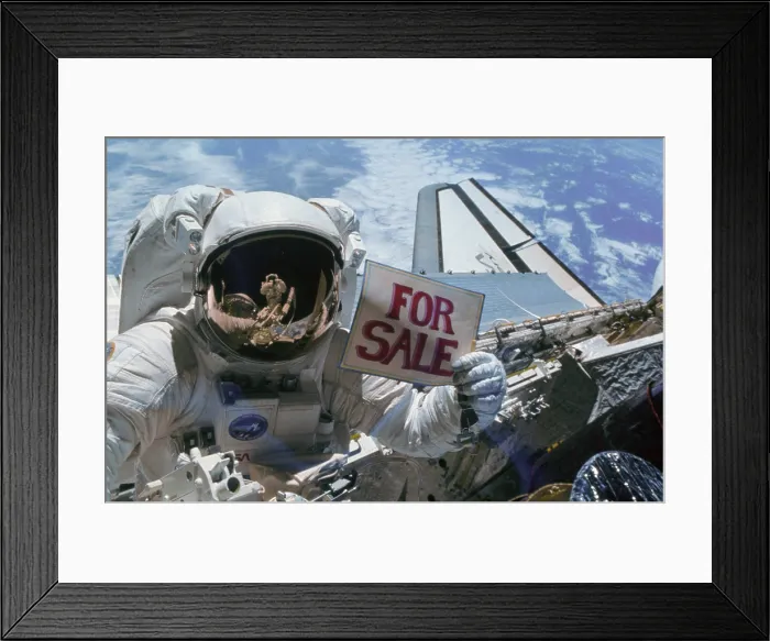 Framed Print : Astronaut Gardner holds a For Sale sign after the orbital retrieval of two malfunctioning satellites the Western Union Telegraph Communication Satellite WESTAR VI Framed Print : Astronaut Gardner holds a For Sale sign after the orbital retrieval of two malfunctioning satellites the Western Union Telegraph Communication Satellite WESTAR VI