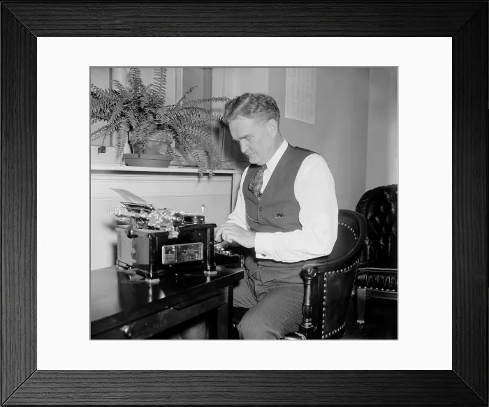 Framed Print : Bruce Barton at a typewriter, possibly when the adman and author served in Congress from 1937 to 1941. (BSLOC_2013_7_117)