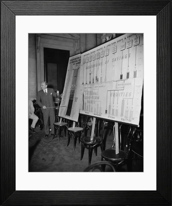 Framed Print : Economist Donald Davenport reports to Monopoly Committee. His charts show that five North Eastern states have $ 37.8 billion of dollars laid up in savings, 67% of U.S. total Framed Print : Economist Donald Davenport reports to Monopoly Committee. His charts show that five North Eastern states have $ 37.8 billion of dollars laid up in savings, 67% of U.S. total