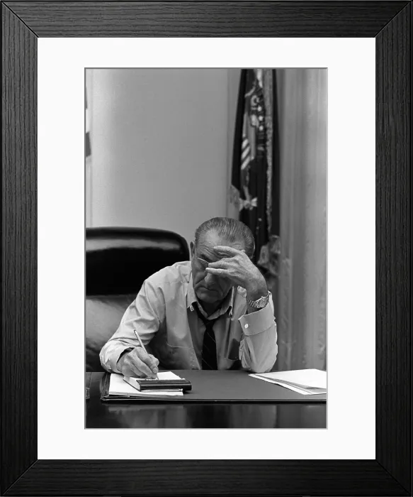 Framed Print : President Lyndon Johnson making notes in Cabinet Room meeting. Four days later, on March 31, 1968, he withdrew from the 1968 presidential contest