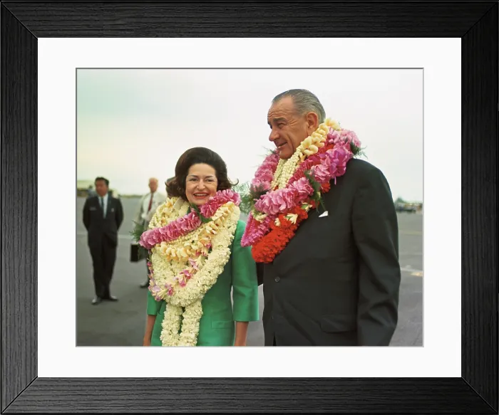 Framed Print : President and Lady Bird Johnson wearing leis in Hawaii. They were on a stop-over before continuing on the Presidents Asian trip. Oct. 18, 1966