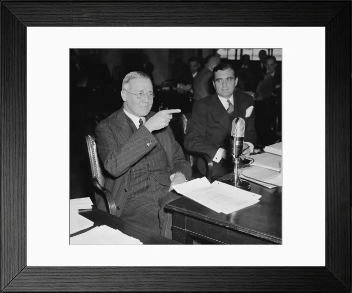 Framed Print : Financier George Whitney, testifies to Congress on Dec. 13, 1939. He was questioned by the National Monopoly Committee about the 33 year business relationship between J
