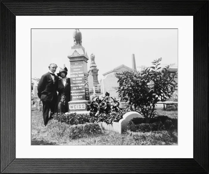 Framed Print : Bess and Harry Houdini at his beloved mother, Cecilia's grave. After her death, Houdini exposed the methods of spiritualist who preyed upon the grief of the bereaved. Ca. 1915 Framed Print : Bess and Harry Houdini at his beloved mother, Cecilia's grave. After her death, Houdini exposed the methods of spiritualist who preyed upon the grief of the bereaved. Ca. 1915