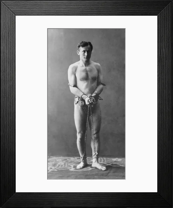 Framed Print : Harry Houdini (1874-1926), in chains. Ca. 1900 Framed Print : Harry Houdini (1874-1926), in chains. Ca. 1900