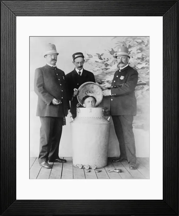 Framed Print : Harry Houdini performs the great milk can escape from a giant milk can filled with water in St. Louis in 1908