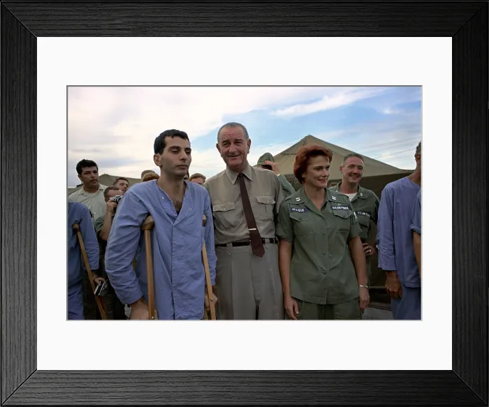 Framed Print : President Johnson in South Vietnam. LBJ with an unsmiling wounded US soldier and Air Force Nurse at Cam Ranh Bay, South Vietnam. Oct. 26, 1966