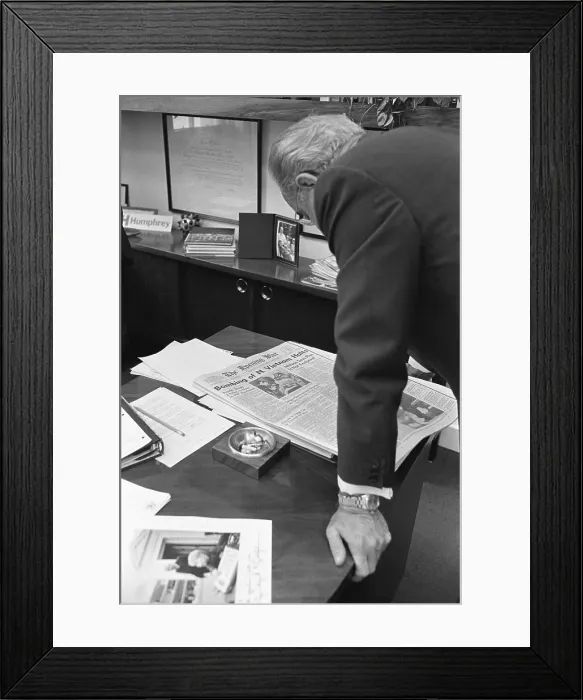 Framed Print : President Lyndon Johnson reading newspaper reporting his concession to North Vietnam's demand to halt all bombing within their borders Framed Print : President Lyndon Johnson reading newspaper reporting his concession to North Vietnam's demand to halt all bombing within their borders