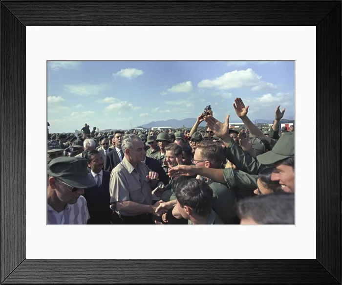 Framed Print : President Johnson in South Vietnam. LBJ shaking hands in a large crowd of troops at Cam Ranh Bay, Air Force Base. Dec. 23, 1967