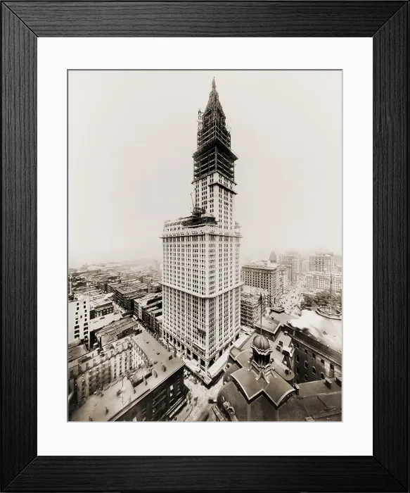 Framed Print : Woolworth Building during the last stages of exterior construction. The tower takes shape and most of the building exterior is faced with white terra cotta. July 1, 1912