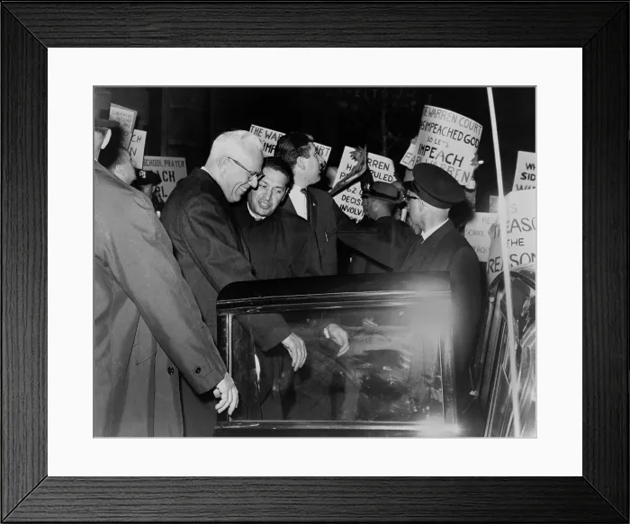 Framed Print : Chief Justice Earl Warren is escorted through crowd of protestors carrying placards attacking the Supreme Court's 1963 ruling (Abington School District v)