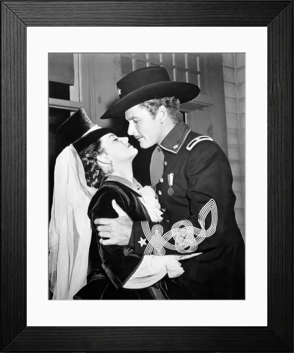 Framed Print : THEY DIED WITH THEIR BOOTS ON, from left, Olivia de Havilland, Errol Flynn, 1941