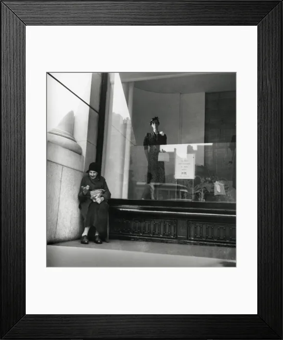 Framed Print : Elderly woman beggar selling pencils during the Great Depression, 1938. She is sheltered against an urban dress shop window