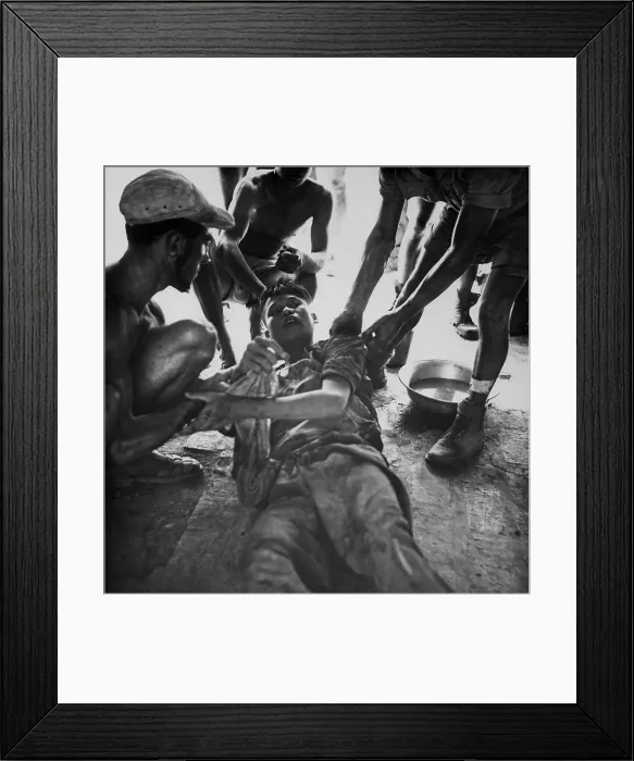 Framed Print : Vietminh POW. A wounded Vietminh prisoner is given first aid by Franco Vietnamese medicals after hot fire fight near Hung Yen, south of Hanoi. Ca