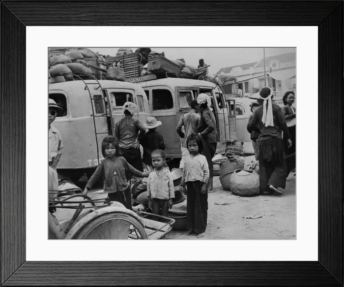 Framed Print : Children and adults evacuating from Nam-Dinh, North Vietnam. An estimated 750, 000 northerners, mostly Catholics, fled to South Vietnam