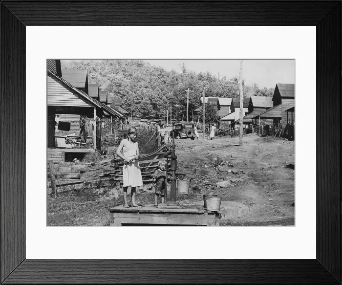 Framed Print : Barefoot children pump water in Wilder, Tennessee, ca. 1935. The pump is the only water supply in this section of town. (BSLOC_2013_7_34)