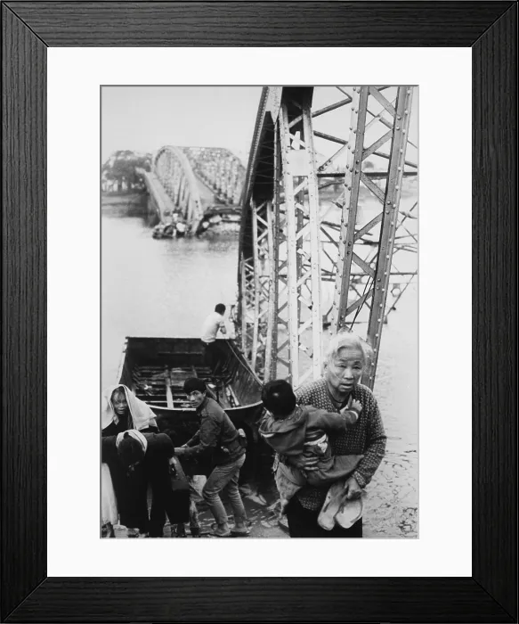 Framed Print : Refugees flee Tet Offensive in Hue. Refugees use a rope ferry to escape to the south shore of the Perfume River despite the destroyed bridge. Ca. February 1968 Framed Print : Refugees flee Tet Offensive in Hue. Refugees use a rope ferry to escape to the south shore of the Perfume River despite the destroyed bridge. Ca. February 1968