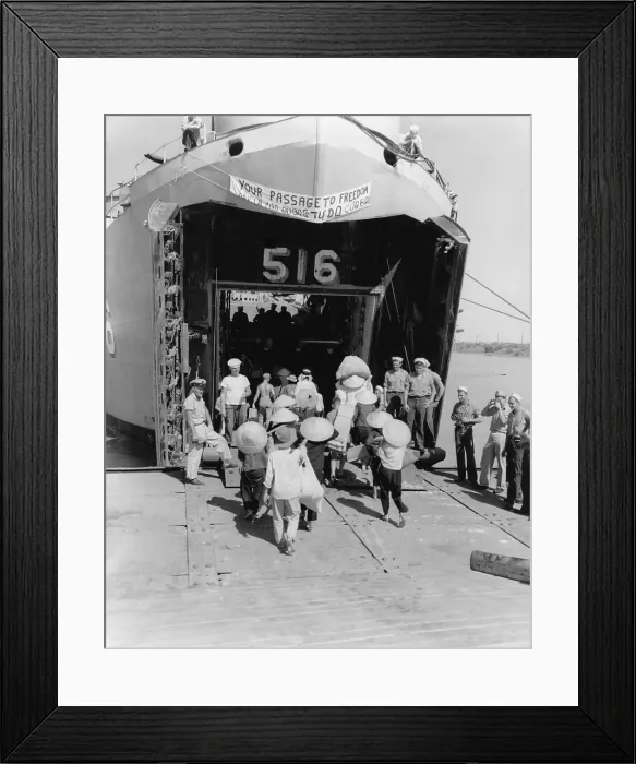 Framed Print : North Vietnamese refugees board an US ship bound for Saigon, South Vietnam. The ship bears a sign reading, YOUR PASSAGE TO FREEDOM Framed Print : North Vietnamese refugees board an US ship bound for Saigon, South Vietnam. The ship bears a sign reading, YOUR PASSAGE TO FREEDOM