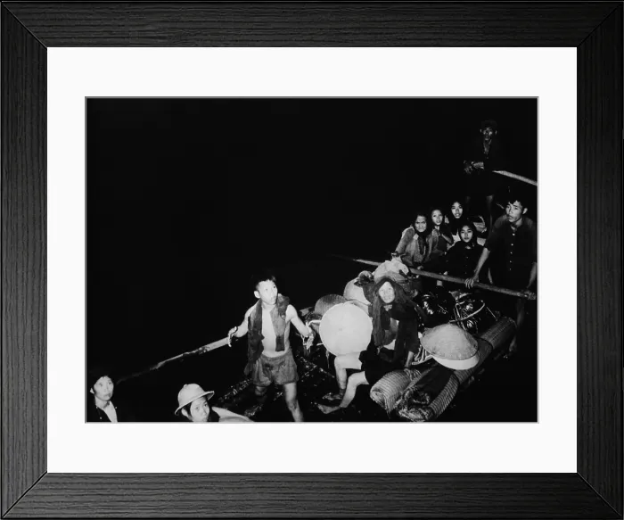 Framed Print : Catholic North Vietnamese refugees. Refugees from Communist held territory in Vietnam pull alongside French landing craft. Ca. 1954 Framed Print : Catholic North Vietnamese refugees. Refugees from Communist held territory in Vietnam pull alongside French landing craft. Ca. 1954