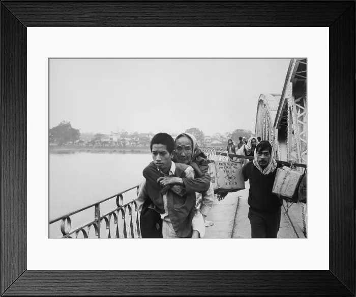 Framed Print : Refugees flee Tet Offensive in Hue. Refugees flee Hue by crossing the Perfume River before the Bridge was destroyed by communist troops Framed Print : Refugees flee Tet Offensive in Hue. Refugees flee Hue by crossing the Perfume River before the Bridge was destroyed by communist troops