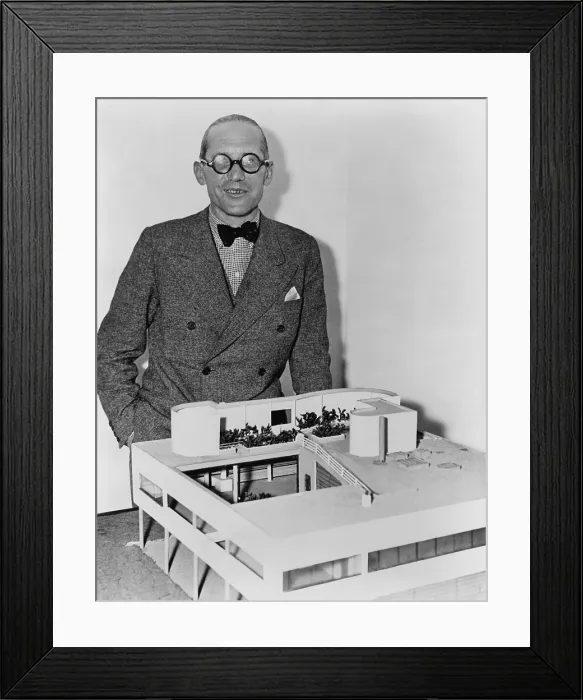 Framed Print : Le Corbusier (1887-1965), revolutionary French architect with a model of his ultra-modern residence, Villa Savoye. 1935 Framed Print : Le Corbusier (1887-1965), revolutionary French architect with a model of his ultra-modern residence, Villa Savoye. 1935