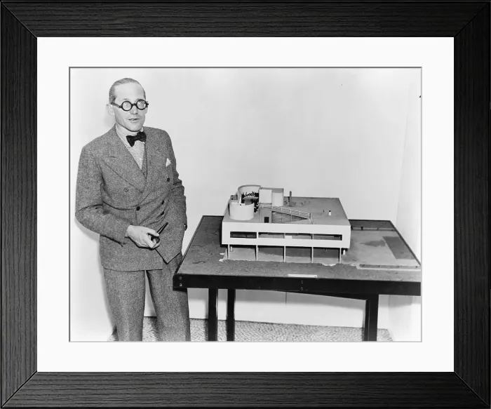 Framed Print : Le Corbusier (1887-1965), with an architectural model of his Villa Savoye, which was built at Poissy, France (1929-31). 1935 photo