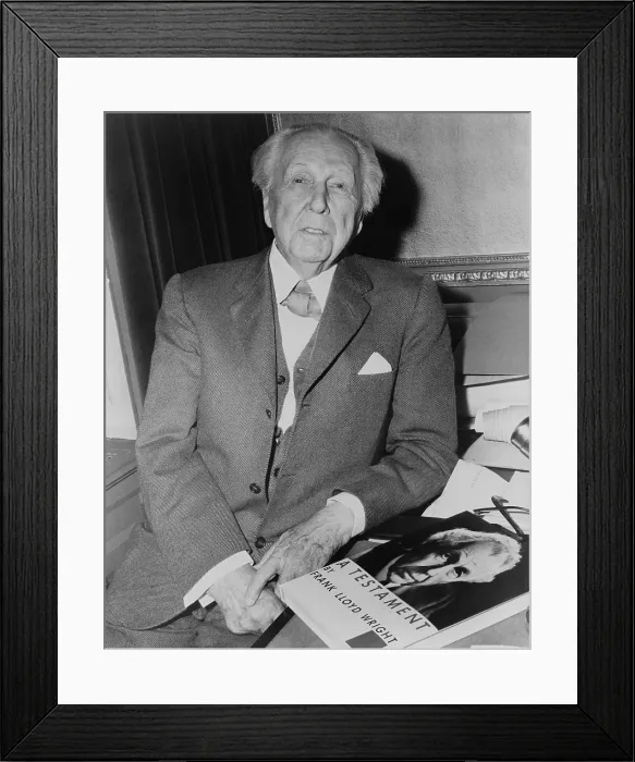 Framed Print : Frank Lloyd Wright (1867-1959), American architect with his 1957 book, A TESTAMENT, an artistic autobiography and summation of his design principles Framed Print : Frank Lloyd Wright (1867-1959), American architect with his 1957 book, A TESTAMENT, an artistic autobiography and summation of his design principles
