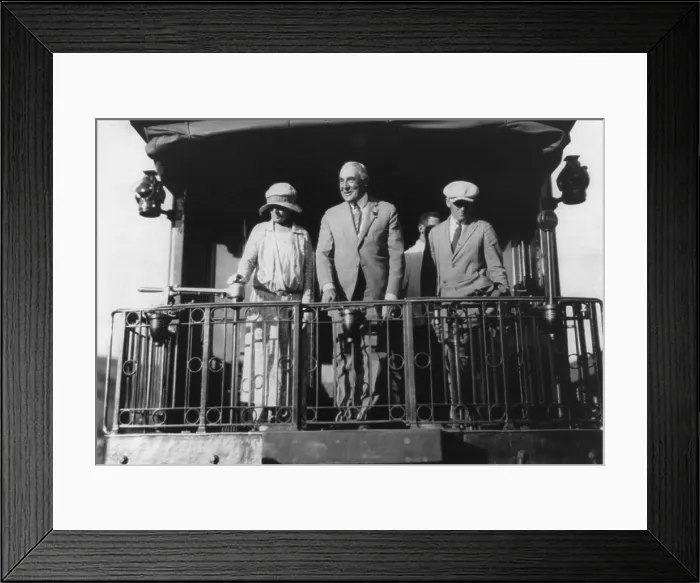 Framed Print : Warren G. Harding (1865-1923), standing on back of Northern Pacific train, with wife Florence and others as they leave Washington, D.C