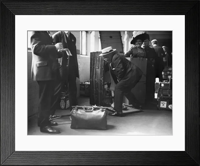Framed Print : Ocean liner passenger struggling thorough a Customs inspection at the Norddeutscher Lloyd pier in New York City. Ca. 1909 LC-DIG-ggbain-04208