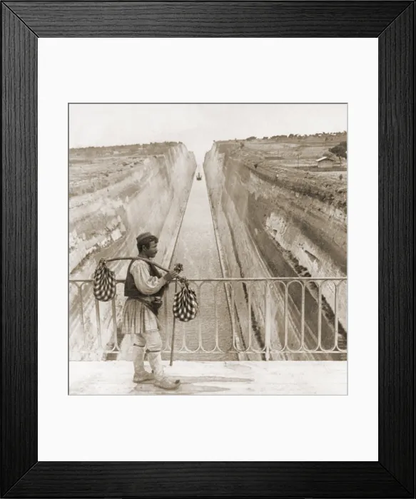 Framed Print : Greek man in traditional costume on a bridge over the Corinth Canal built between 1881 and 1893