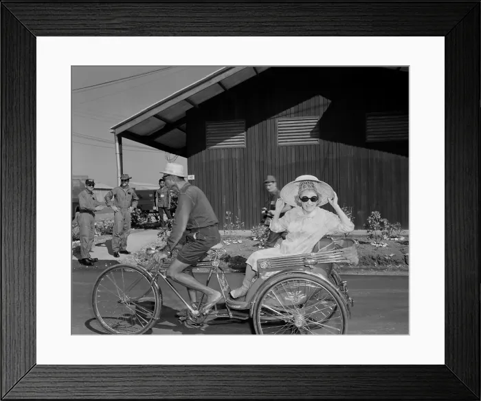 Framed Print : USO entertains troops in Thailand. Comedienne Phyllis Diller rides in a tricycle rickshaw as the Bob Hope USO Christmas show arrives at Korat Air Base, Thailand. Dec. 1966 Framed Print : USO entertains troops in Thailand. Comedienne Phyllis Diller rides in a tricycle rickshaw as the Bob Hope USO Christmas show arrives at Korat Air Base, Thailand. Dec. 1966