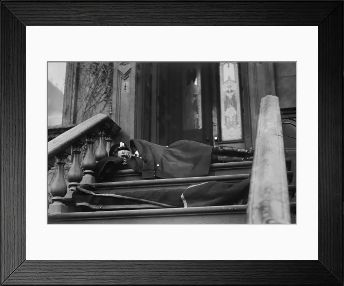 Framed Print : Policeman sleeping on the porch of a New York City brownstone during the strike by wagon drivers of Adams Express, American Express, and Wells Fargo. 1910