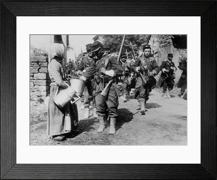 Framed Print : World War 1. French troops on the march, and during the Battle of the Marne. A village women supplies them with drinking water. Ca. September 6-12, 1914