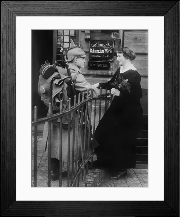 Framed Print : World War 1. Young German couple saying goodbye. The soldier wears his uniform with full gear including his backpack and rifle. Ca. 1914 Framed Print : World War 1. Young German couple saying goodbye. The soldier wears his uniform with full gear including his backpack and rifle. Ca. 1914