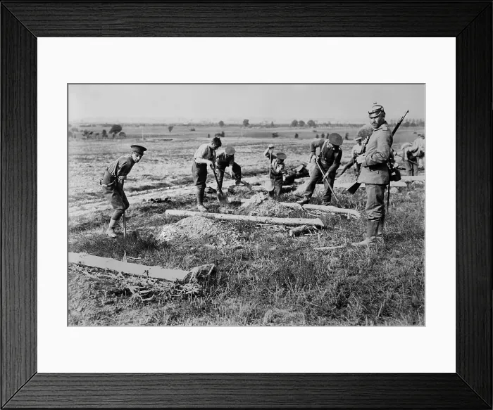 Framed Print : English WW1 POWs prisoners at work near Doberitz, Germany. 1914-15. Deep within eastern Germany they labor with shovels under an armed guard. (BSLOC_2012_4_184)