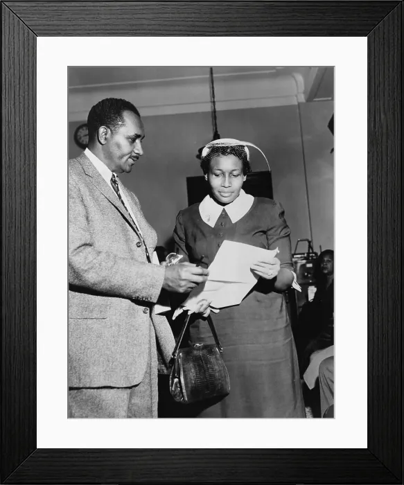 Framed Print : Beatrice Young, victim of police beating. Young talks with Clarence Mitchell of NAACP after testifying before the Senate Subcommittee on Constitutional Rights. Feb. 28, 1957