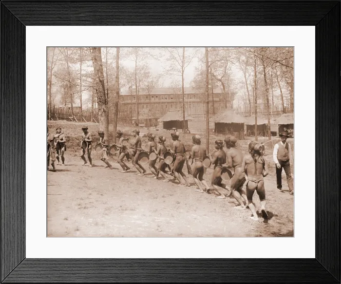 Framed Print : Igorot men from the Philippines dance in a semi-circle. The huts in the background are part of the Louisiana Purchase Exposition. 1904 Framed Print : Igorot men from the Philippines dance in a semi-circle. The huts in the background are part of the Louisiana Purchase Exposition. 1904