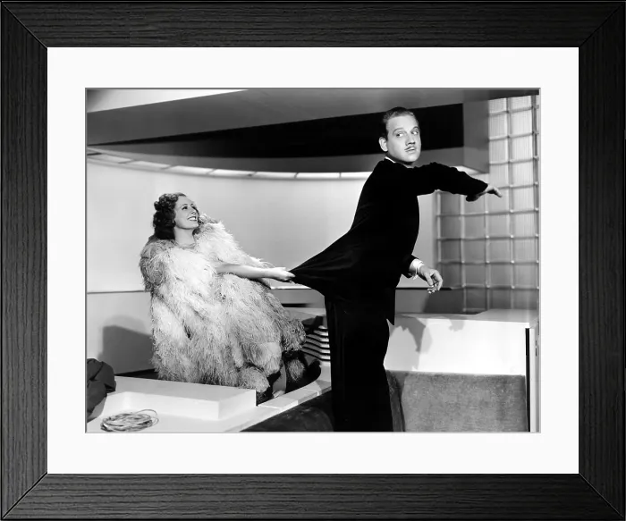 Framed Print : THEODORA GOES WILD, Irene Dunne, Melvyn Douglas, 1936, catching his coattails Framed Print : THEODORA GOES WILD, Irene Dunne, Melvyn Douglas, 1936, catching his coattails