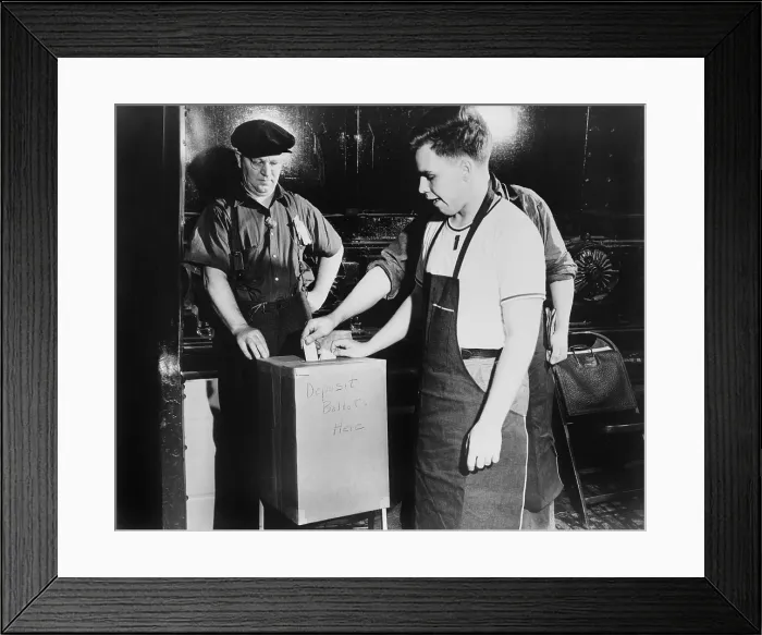 Framed Print : Workers depositing ballot during a National Labor Relations Board election for union representation at the River Rouge Ford plant in Dearborn, Michigan. June 1941