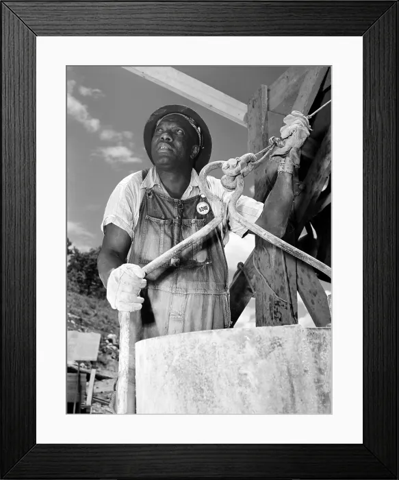 Framed Print : African American construction worker at the Douglas Dam on the French Broad River, one of the Tennessee Valley Authority public works projects of the New Deal. June 1942 Framed Print : African American construction worker at the Douglas Dam on the French Broad River, one of the Tennessee Valley Authority public works projects of the New Deal. June 1942