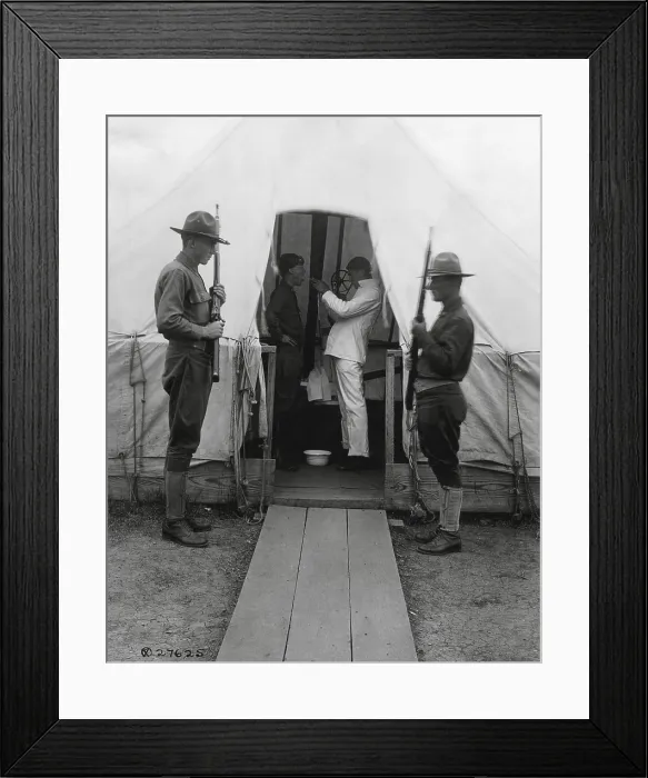 Framed Print : American soldier gets throat sprayed to prevent influenza. Dec. 1918. Medical tent at Love Field, Dallas, Texas, during the 1918-19 Spanish Influenza pandemic