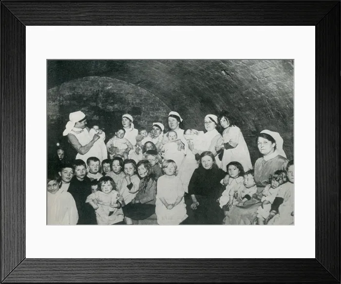 Framed Print : British nannies in a basement bomb shelter, probably in London during World War 1. From 1915-1918, Britain suffered approximately 50 raids with about 550 deaths and 1350 injuries Framed Print : British nannies in a basement bomb shelter, probably in London during World War 1. From 1915-1918, Britain suffered approximately 50 raids with about 550 deaths and 1350 injuries