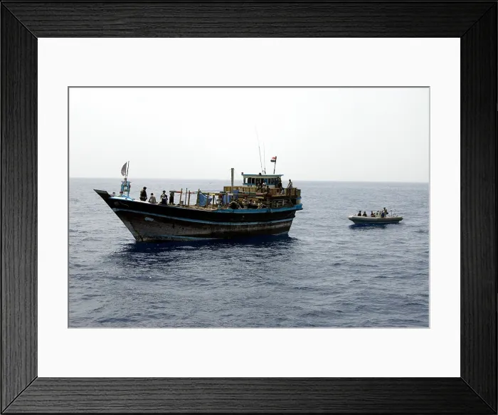Framed Print : U.S. Navy and Coast Guard counter piracy personnel interview passengers aboard a drifting Yemeni dhow in the Gulf of Aden Framed Print : U.S. Navy and Coast Guard counter piracy personnel interview passengers aboard a drifting Yemeni dhow in the Gulf of Aden