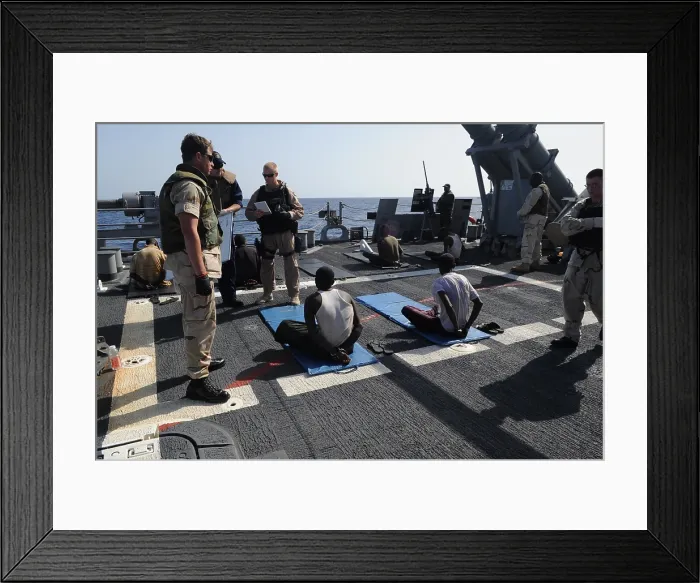 Framed Print : U.S. Sailors guard suspected pirates on the flight deck of the guided missile cruiser USS Gettysburg in the Gulf of Aden April 17 2009