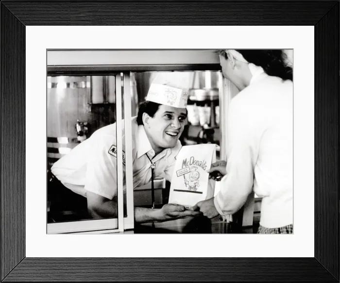 Framed Print : McDonald's restaurant crew member at the window handing a customer a bag. 1950s. McDonald's Corp. photo. Photo by:Everett Collection(BSLOC_2011_6_180)