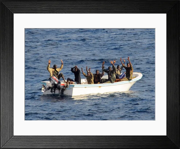 Framed Print : Seven suspected pirates with hands raised on orders of a U.S. Naval counter-piracy search and seizure team in the Gulf of Aden. Feb Framed Print : Seven suspected pirates with hands raised on orders of a U.S. Naval counter-piracy search and seizure team in the Gulf of Aden. Feb