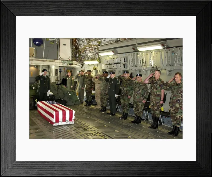 Framed Print : U.S. Military personnel salute the flag draped coffin Chief Petty Officer Matthew J. Bourgeois during his Fallen Soldier Ceremony at Ramstein Air Base Germany