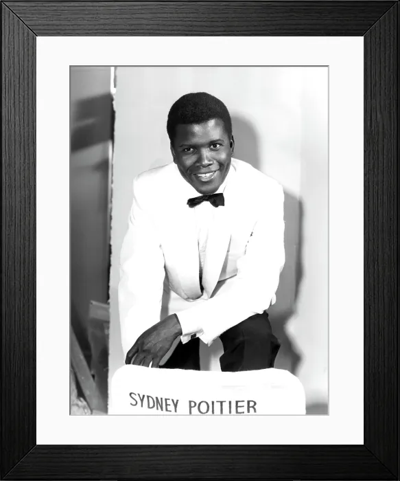 Framed Print : MARK OF THE HAWK, Sidney Poitier, next to his misspelled director's chair, at Elstree Studios, UK, January, 1957 Framed Print : MARK OF THE HAWK, Sidney Poitier, next to his misspelled director's chair, at Elstree Studios, UK, January, 1957
