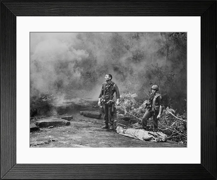 Framed Print : Vietnam War. Two American GIs standing over the body of a fallen comrade after the day's battle was finished. Long Khanh Province, Republic of Vietnam, 1966 Framed Print : Vietnam War. Two American GIs standing over the body of a fallen comrade after the day's battle was finished. Long Khanh Province, Republic of Vietnam, 1966