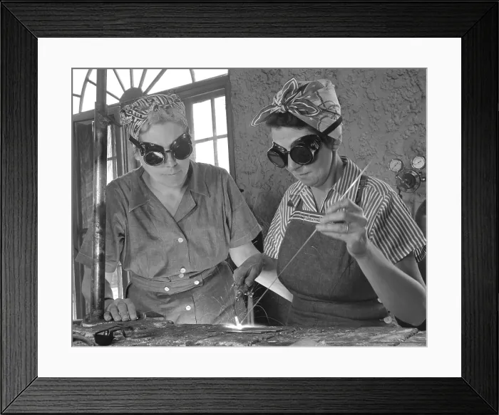 Framed Print : Two Daytona Beach, Florida, housewives welding in an Aircraft construction class during World War II. Both have sons in the military. April 1942