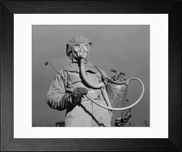 Framed Print : World War II era American soldier in a decontamination suit. December 1942